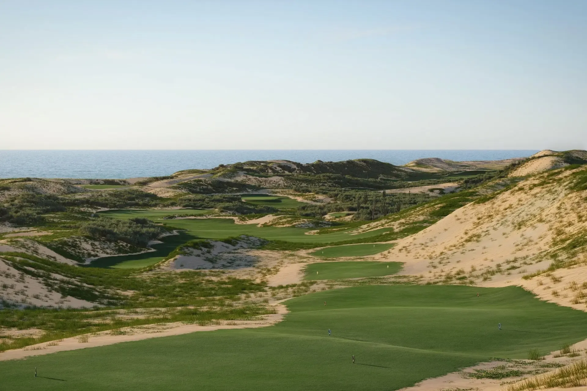 Oleada Golf Links fairways among dunes with the Pacific beyond