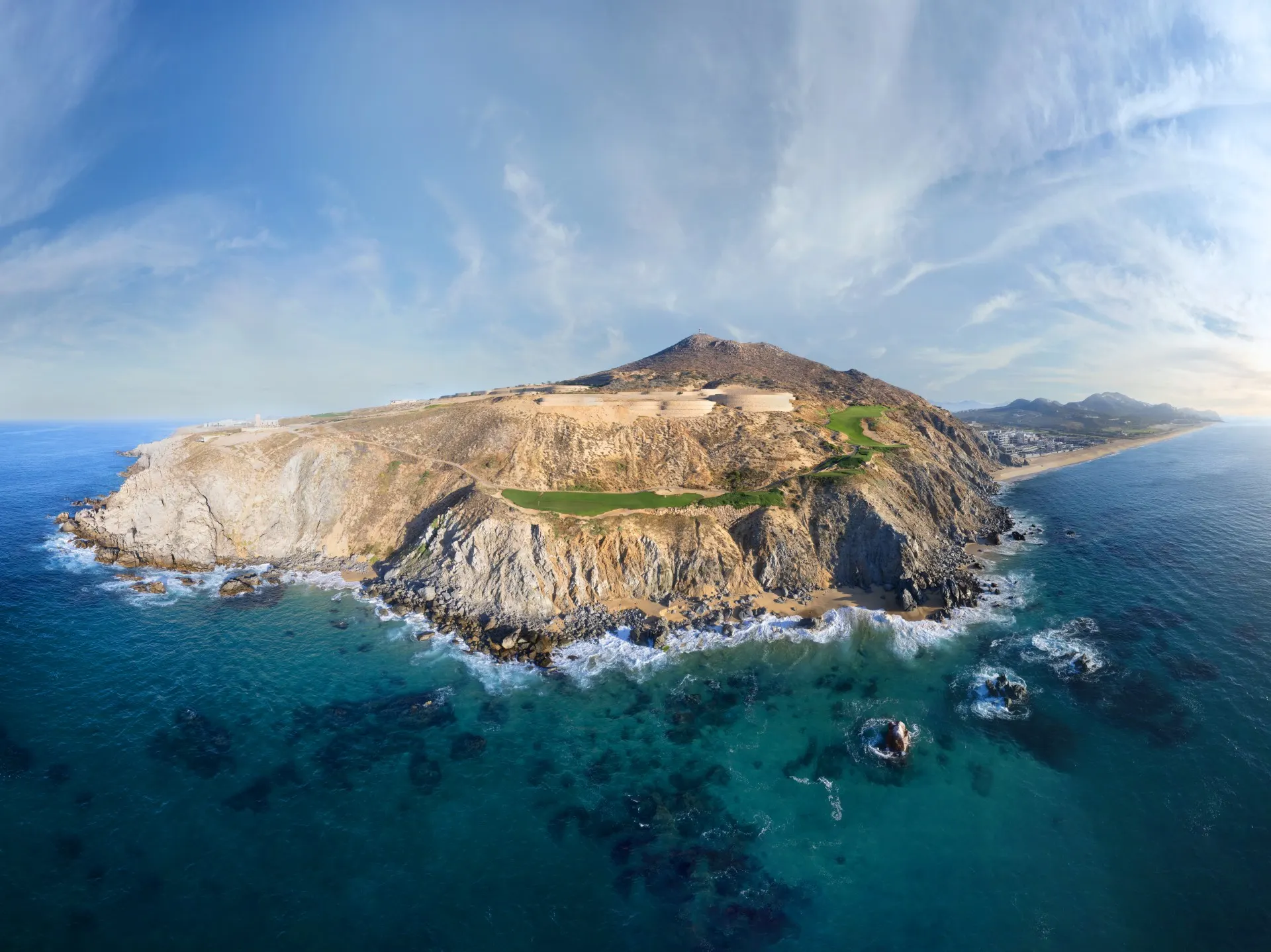 Aerial of Quivira Golf Club's clifftop holes on a rocky headland