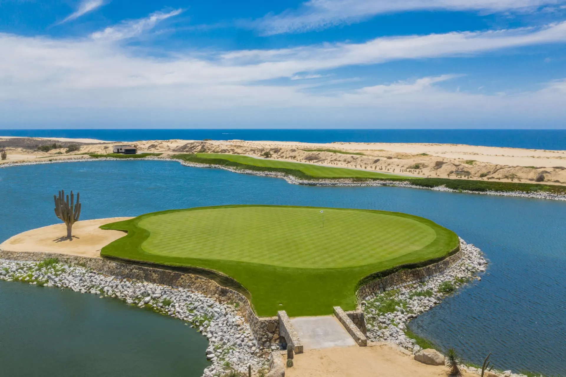 Island green surrounded by water at Solmar Golf Links